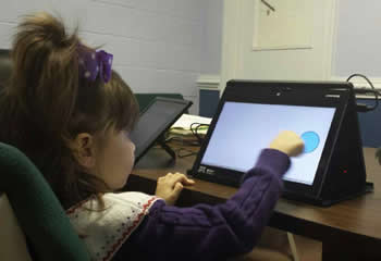 child with touchscreen